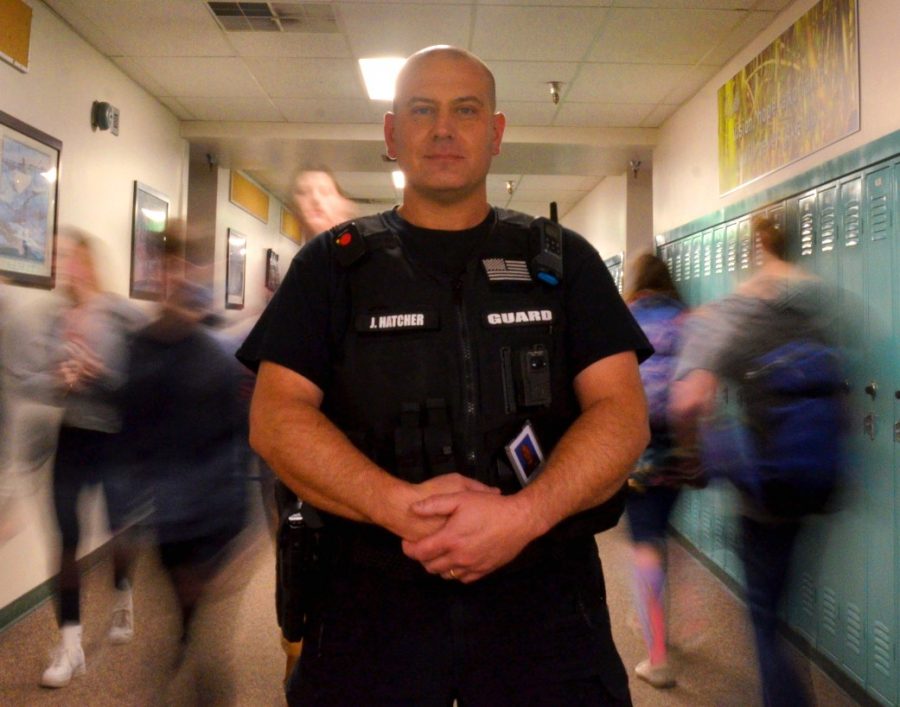 Mr. Hatcher standing stoutly in the hallway as the kids pass by. He stands there with the intent to watch and protect.