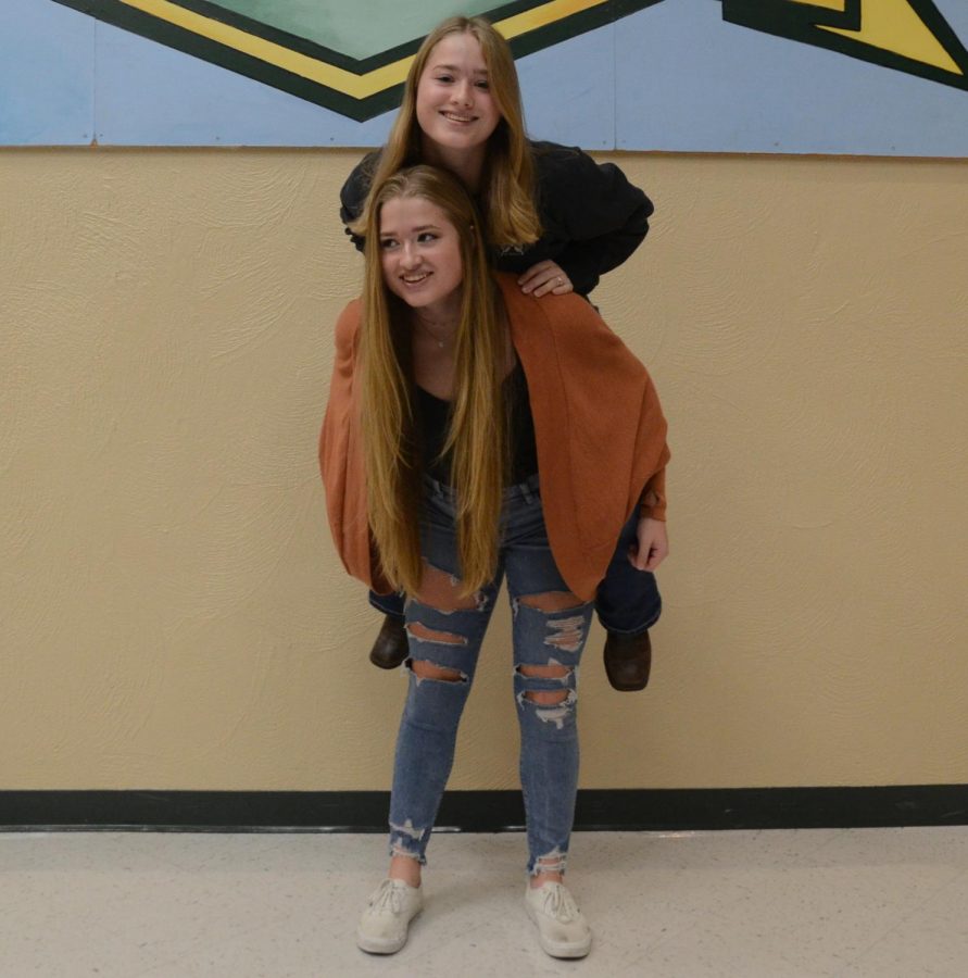 Makayla gives Mckenzie a piggy back ride as some of the most athletic twins in the school.

