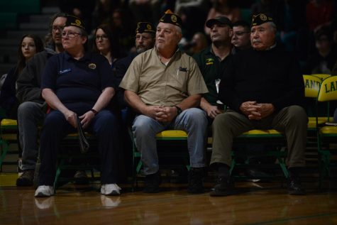 A group of veterans watches the assembly