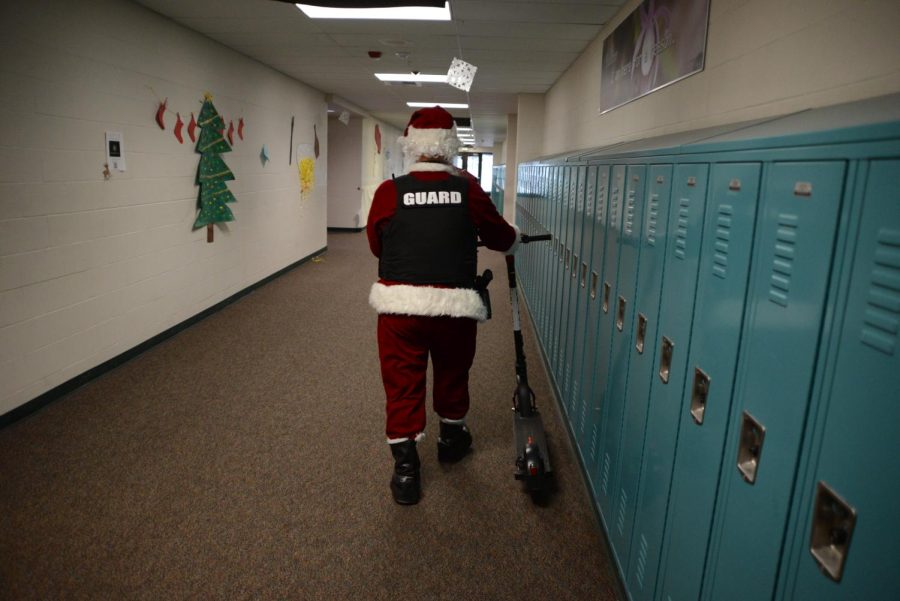 Officer Hatcher Claus walks down the hall