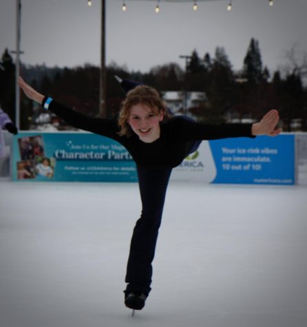 Maddy Hasz does an arabesque on the ice.