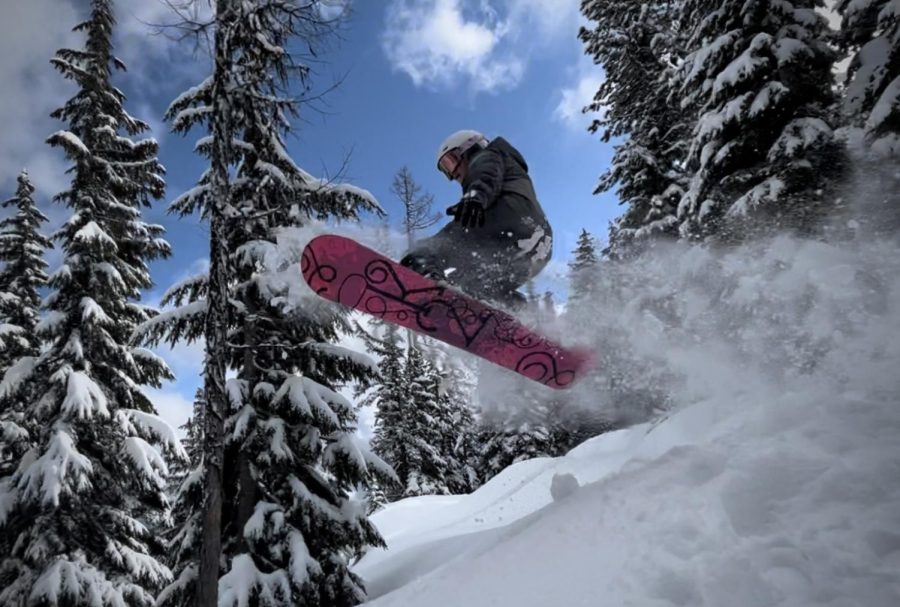 Baylee Frank jumps on a snowboard