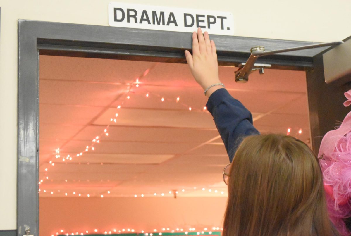 Emma Davis entering the Drama Department Classroom.