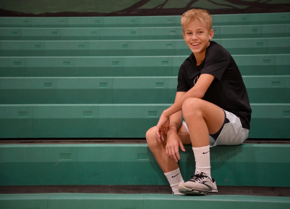 Josh Caywood sits on the bleachers at Lakeland High School.
