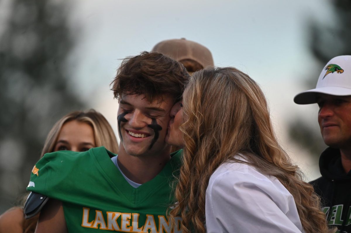 Kage Weil's mom kisses Kage on the cheek.