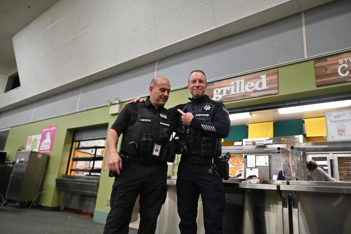 Hatcher and Hutson as police officers 