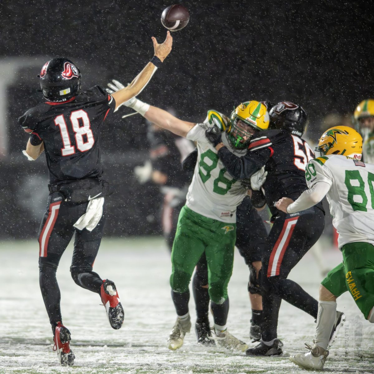 Landon Burmeister (88) tries to block a pass in Fridays semi-final game against Hillcrest High School in Ammon Idaho