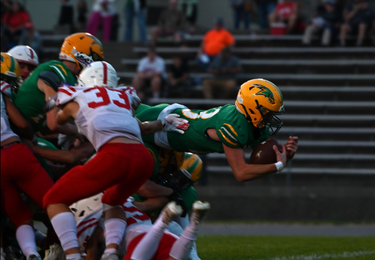 Kage Weil dives for the touchdown.