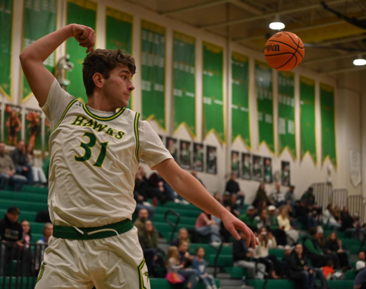 Peyton Hillman saves the ball from going out of bounds