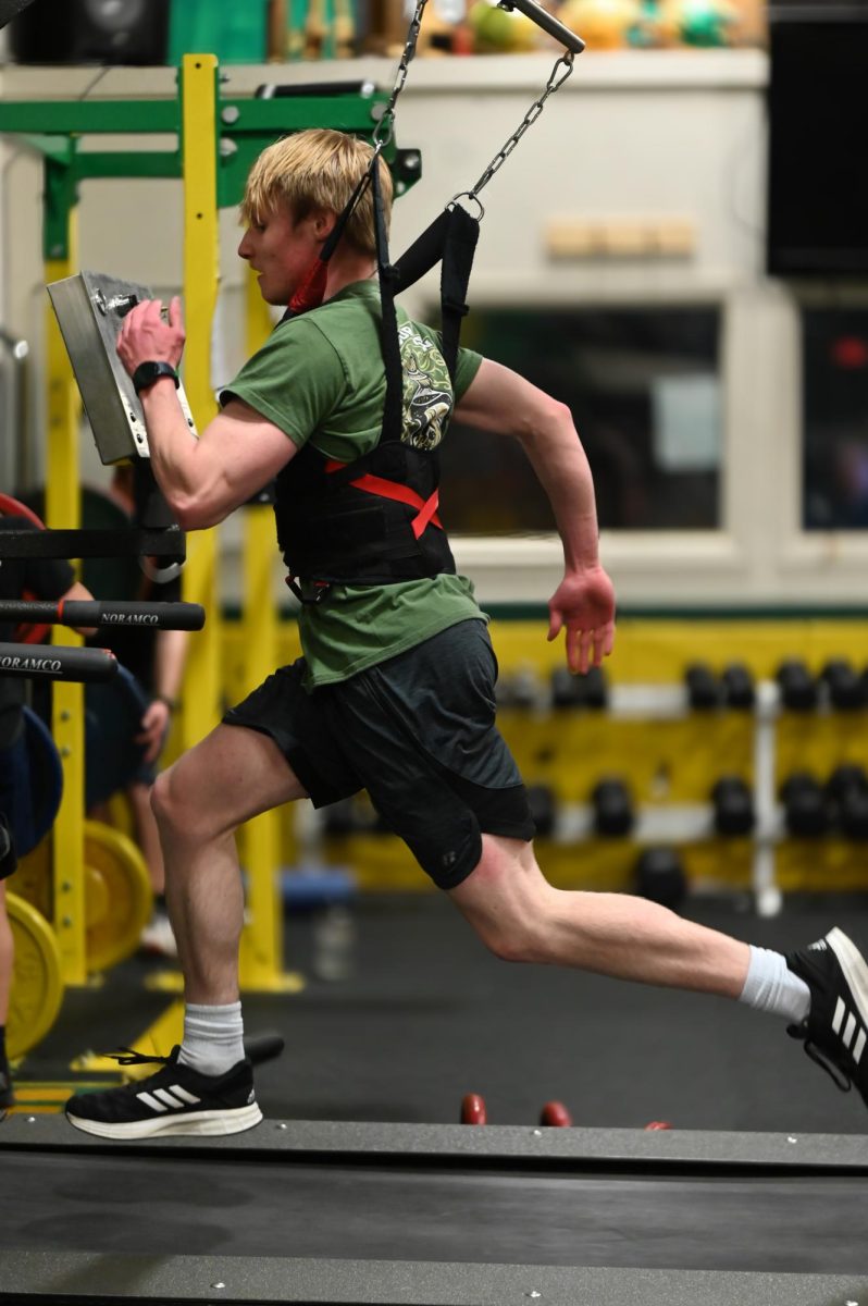 Stryker Vestal sprints on the treadmill.