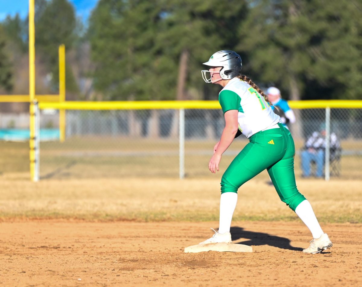 Kiersten Drake waits to run to third base. 