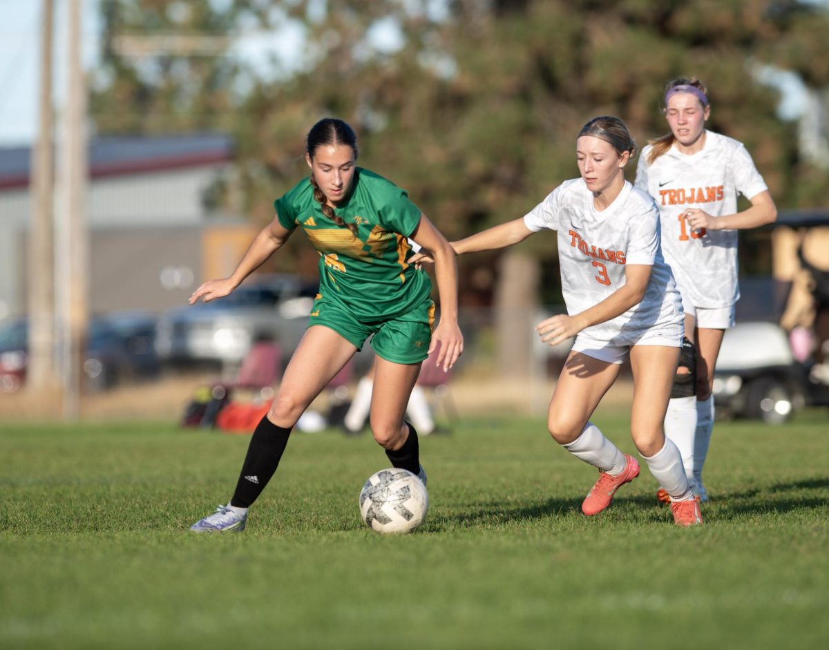 Karstyn Kiefer defends the ball from Post Falls.