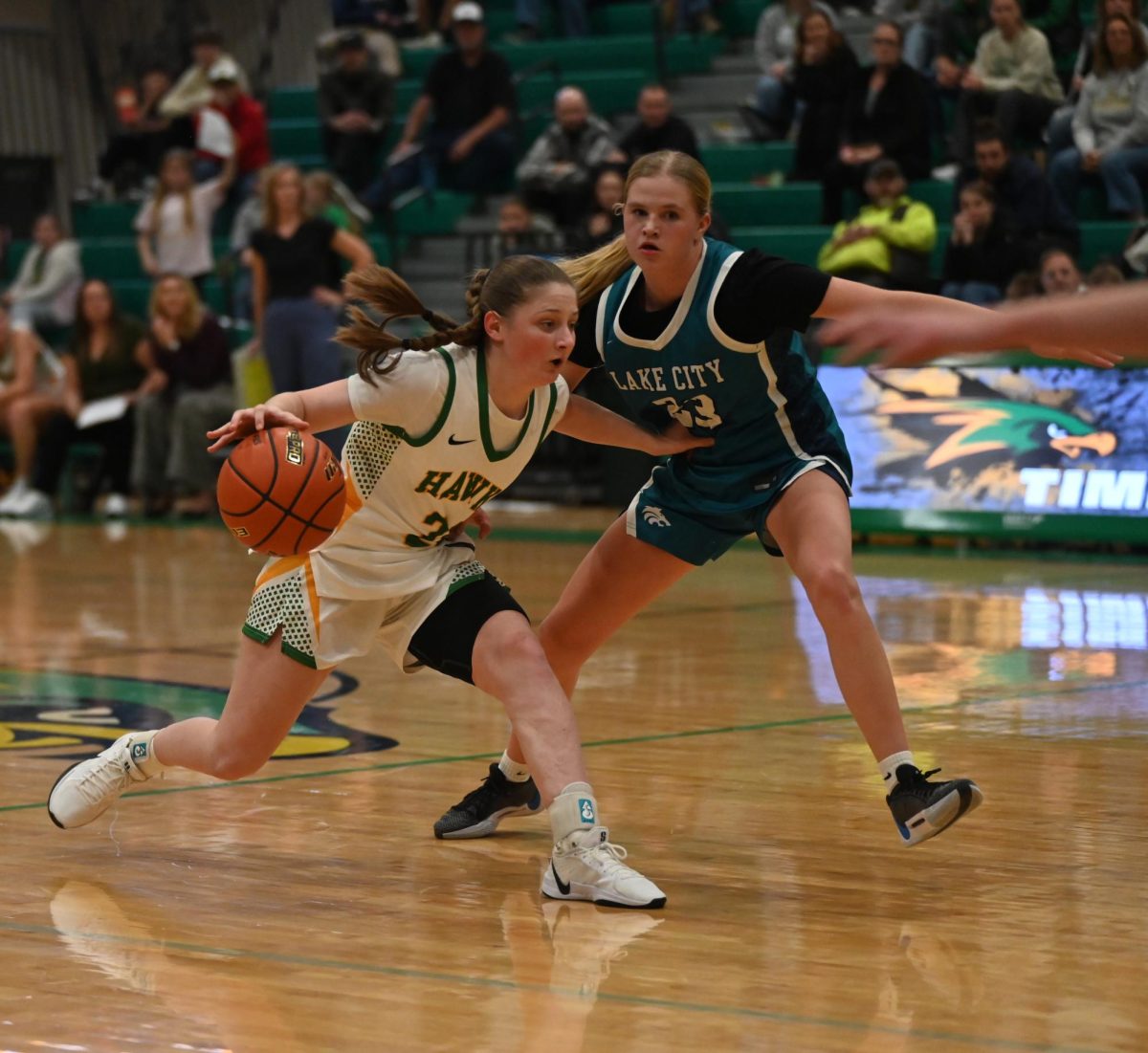 Presley Fagon dribbling the ball down the court while blocking the defence
