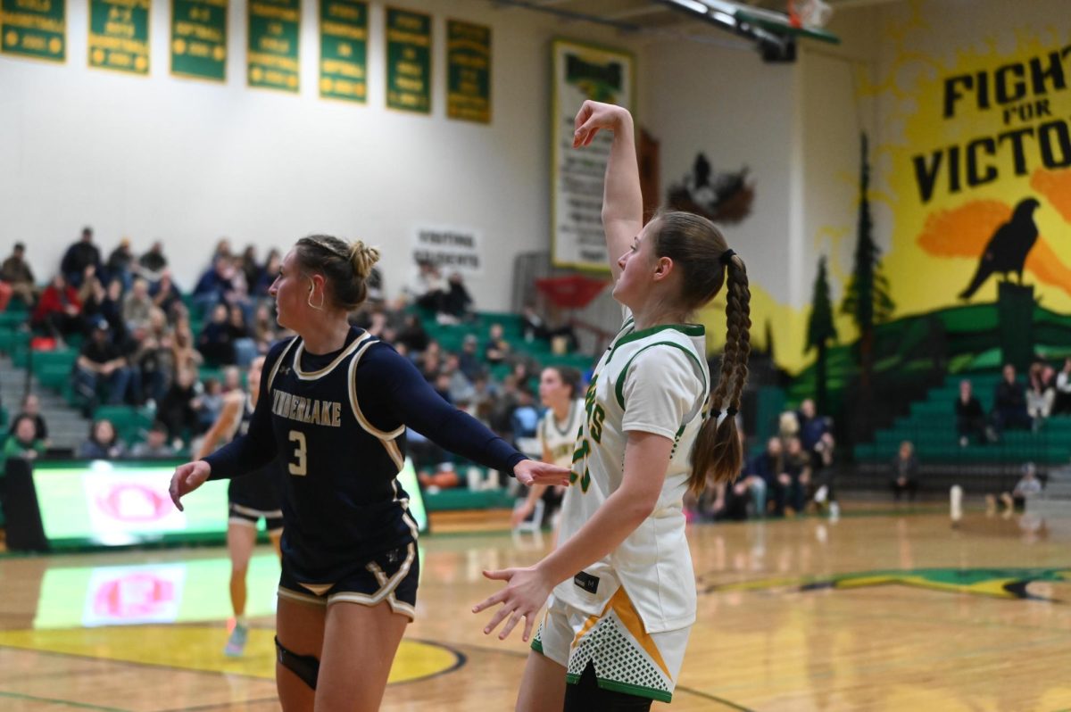 Presley Fagan holding her form after a three point shot during the Hawks win over Timberlake on Nov. 20
