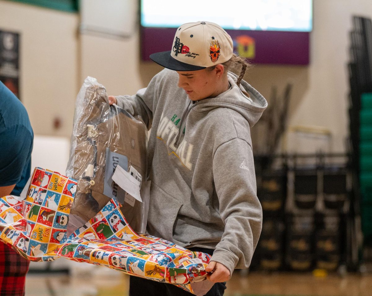 Marisa Evans opens a gift for her brother.