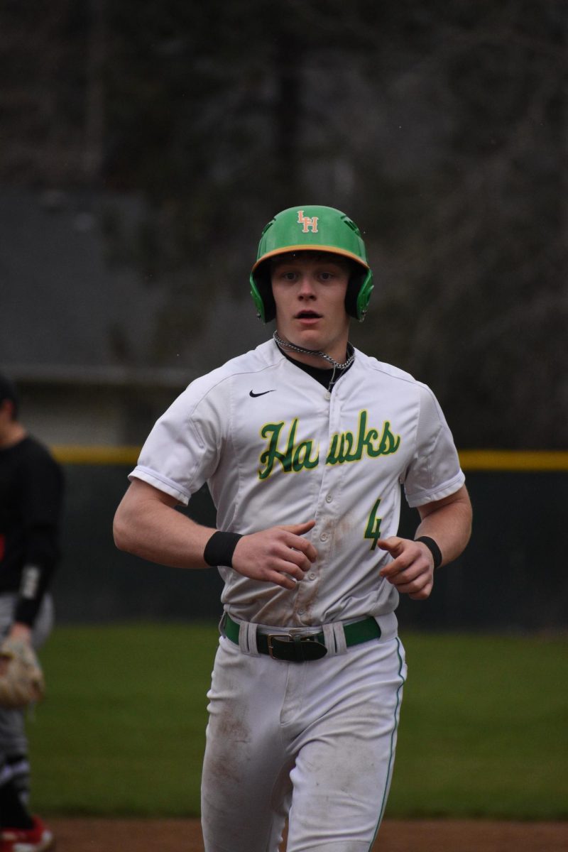 Hunter Averitt running the bases for the Hawks on senior day.