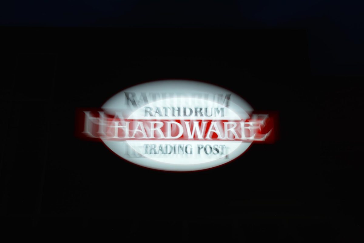 The Rathdrum Hardware Trading Post sign taken with shutter drag.