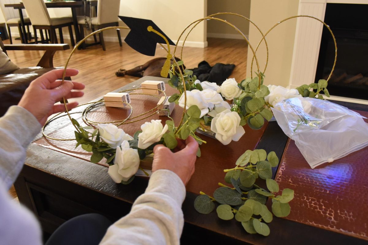 Kellie Dewey finishing up the center pieces.