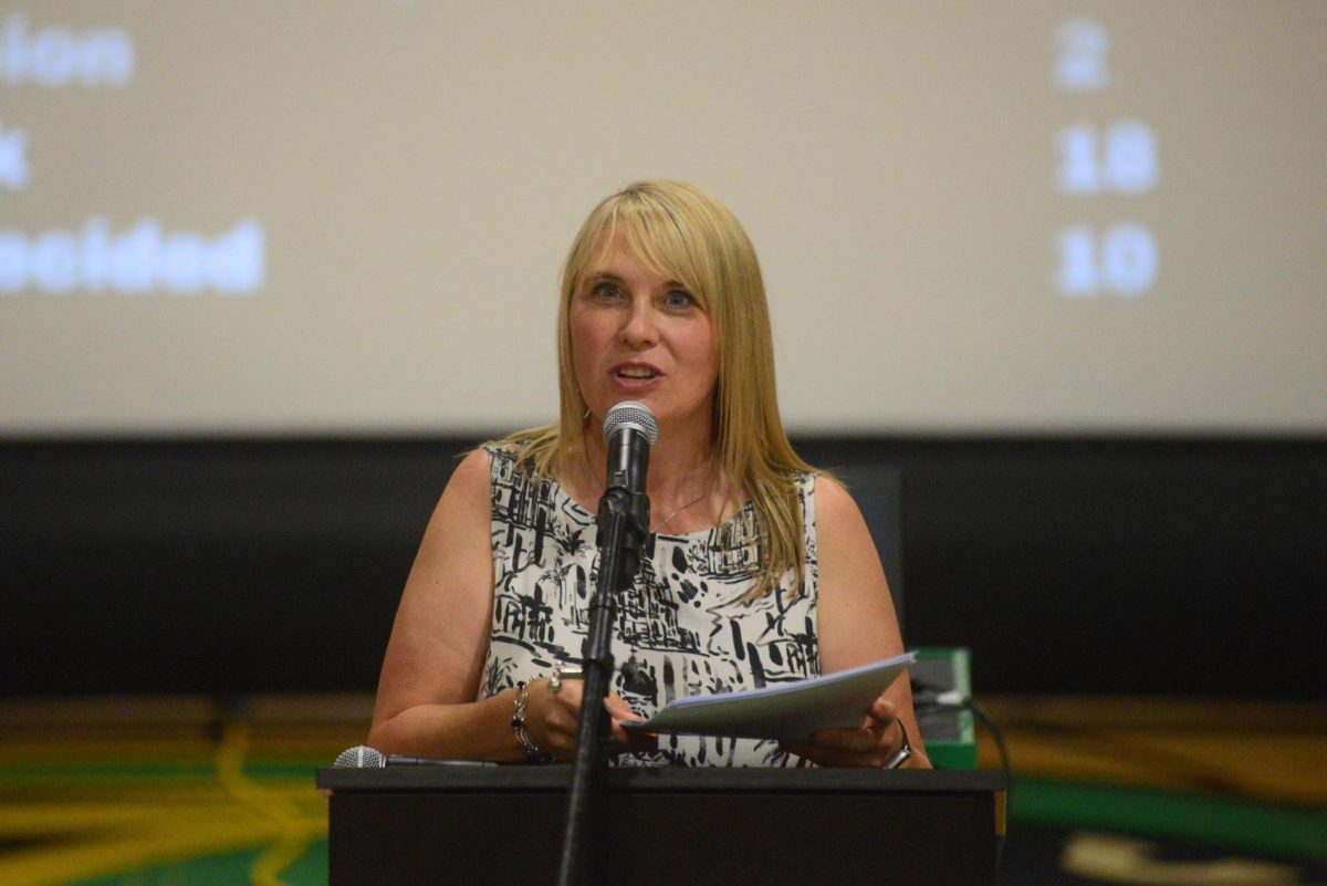 Mrs. Paquette speaking at the 2026 senior awards assembly